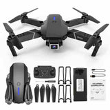 Foldable RC drone with dual cameras, remote controller, and spare propellers