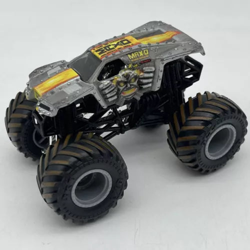 1:64 diecast monster truck with gray cab, yellow graphics, and oversized black tires