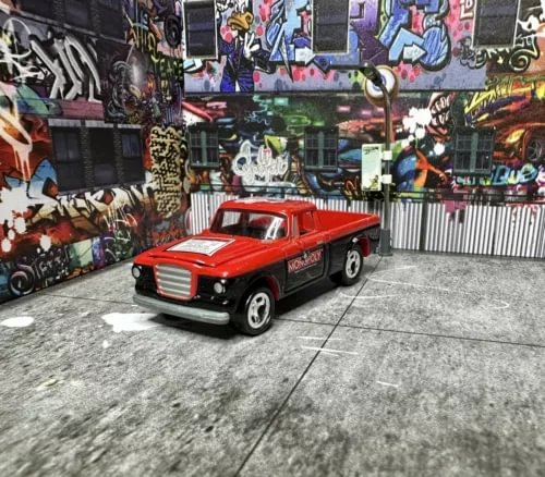 Red 1960 Studebaker-style diecast pickup truck with open hood, front three-quarter view