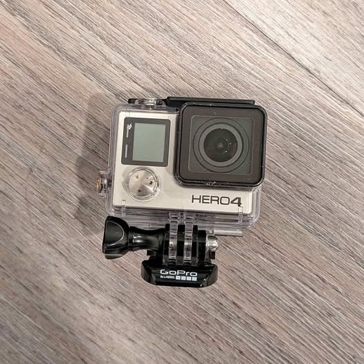 GoPro HERO4 action camera in clear waterproof case with side mount