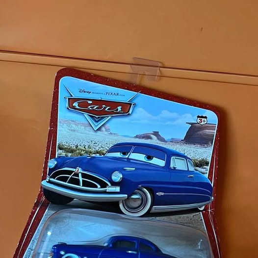 Disney Cars diecast car in box, blue vintage front view with grille