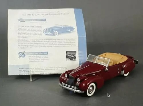 Franklin Mint diecast Packard Victoria convertible model, maroon with tan roof