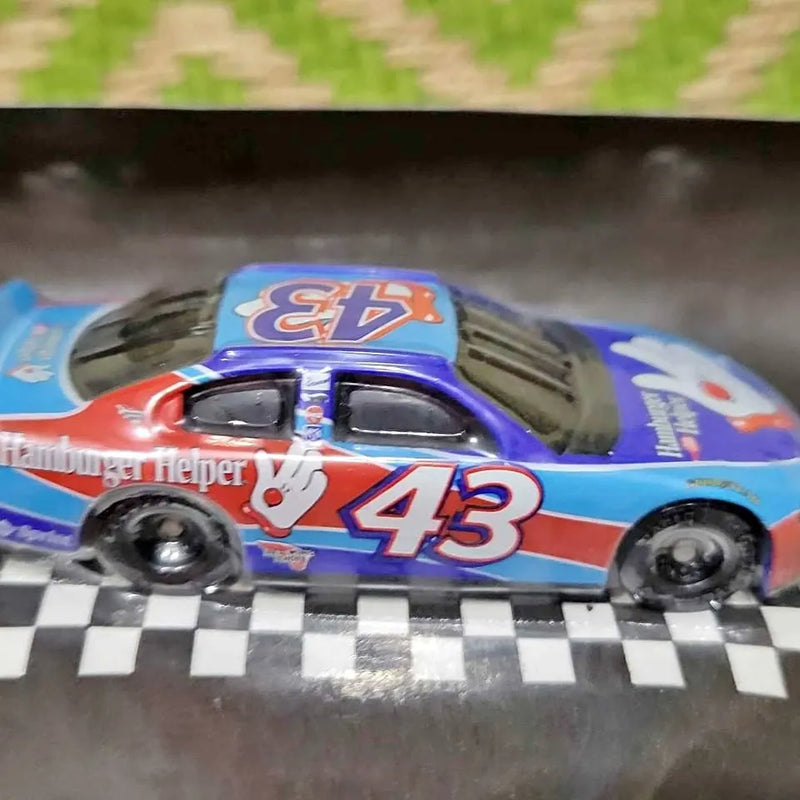 Blue diecast race car with #43 on side and Hamburger Helper logo, front view