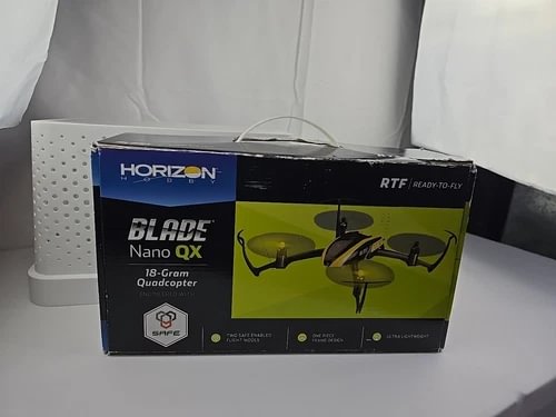 RTF quadcopter drone retail box with Blade Nano QX branding and green rotor graphic