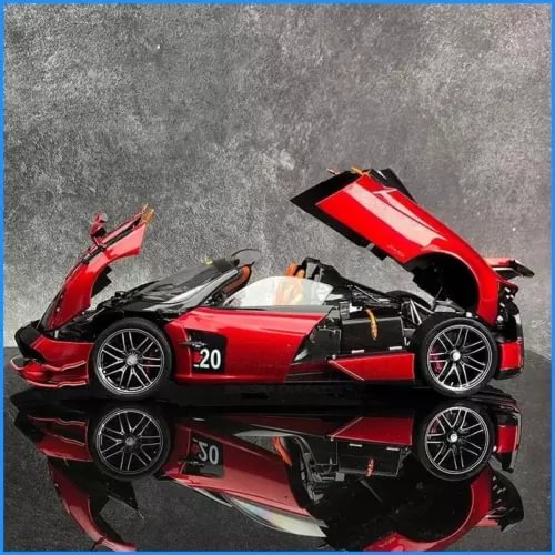 Red and black 1:18 scale alloy sports car model diecast with rear wing