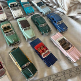 Lot of 23 diecast model cars, 1:43 scale, assorted colors and body styles.
