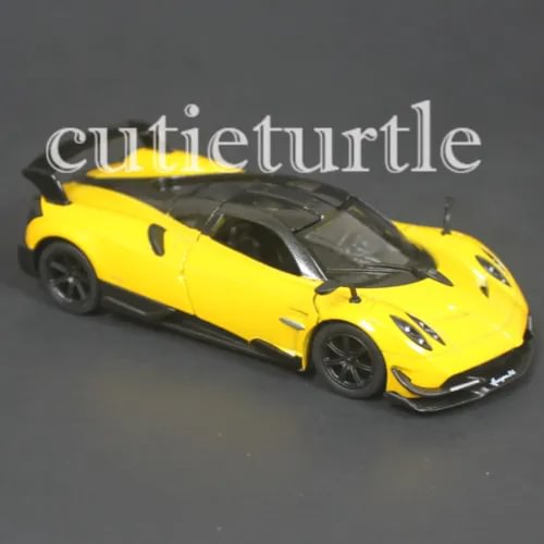 Yellow diecast toy car with black wheels and hood vents, front three-quarter view