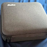 Ruko drone hard carrying case, gray fabric exterior with zipper pull