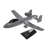 Grey fighter jet model with propeller detailing on black display base