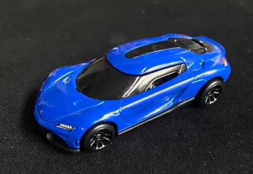 Blue diecast sports car with black hood and silver accents, toy size, open wheels