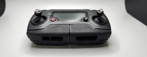 DJI Mavic Pro radio controller with dual thumbsticks and screen panel, front ports