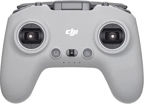 DJI FPV remote controller with dual thumbsticks and circular control pods, gray