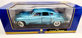 Light blue diecast 1:18 Tucker Torpedo model car in display box with stand