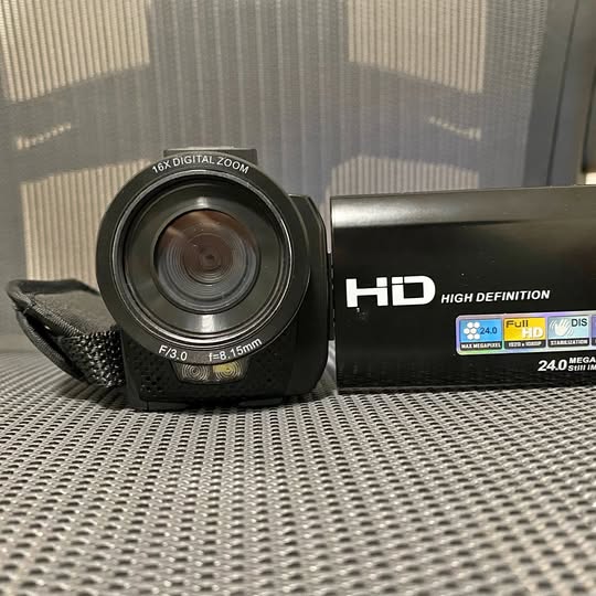 Compact HD video camera with front lens and 24MP label