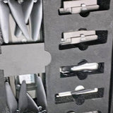 Drone parts and accessories in gray foam insert with molded compartments