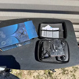 Drone kit carrying case open with compartments and propeller parts