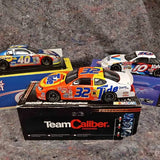 1:24 NASCAR diecast race cars, front view on Team Caliber display boxes