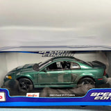 Green and black 2003 Ford SVT Cobra diecast car model, side view in display box
