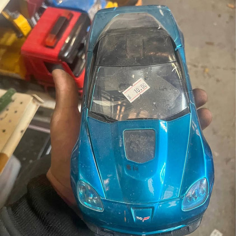 Blue diecast car front with windshield and headlights