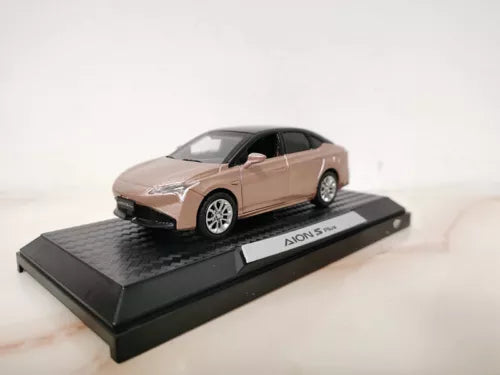 Diecast alloy AION S Plus car model on black display base, light pink and white.