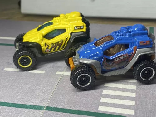 Yellow and blue diecast spark arrester vehicles, side-by-side front view