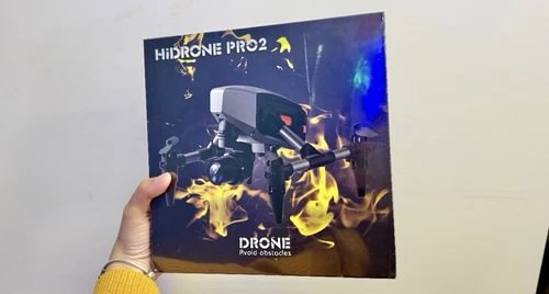 Drone product box with blue and black design and glowing flame graphics
