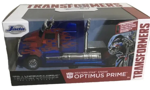Diecast Optimus Prime truck toy in box, blue cab with orange details