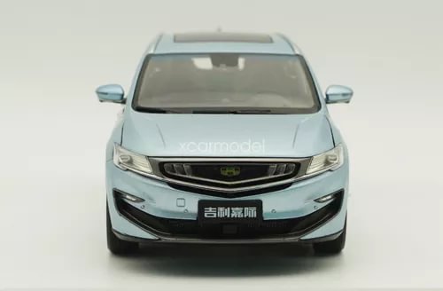 Blue 1/18 scale MPV diecast car model with front grille and headlights