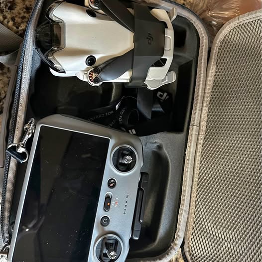 DJI Mini 4 Pro drone in carry case with remote and display