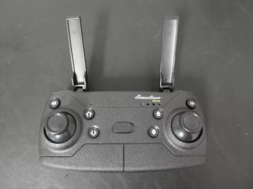 RC drone remote controller with two joysticks and multiple buttons