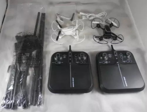 Set of 2 black drone controllers with antennas and accessory parts