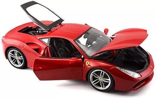 Red diecast sports car model with hood and doors open, visible interior and wheels