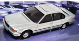 Silver diecast model car, front-left view, classic 2-door sedan.