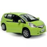 1/36-scale Honda Jazz green diecast model car with chrome wheels, front three-quarter view