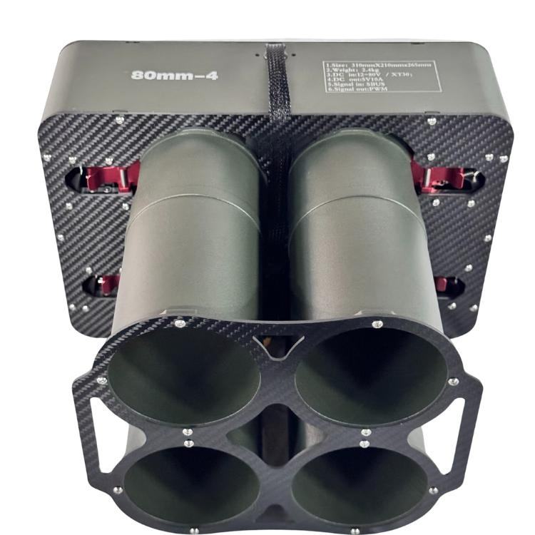 Mini drone dropper launcher module with four circular bays and two gray tubes