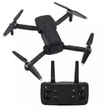 Foldable black quadcopter drone with four propellers and controller