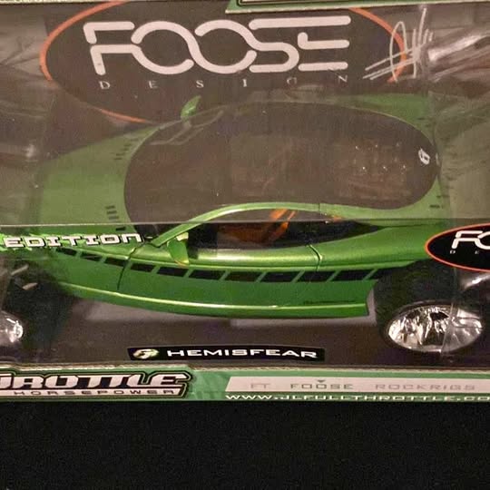 Green diecast model car front with headlights and FOOSE/HemisFear decals