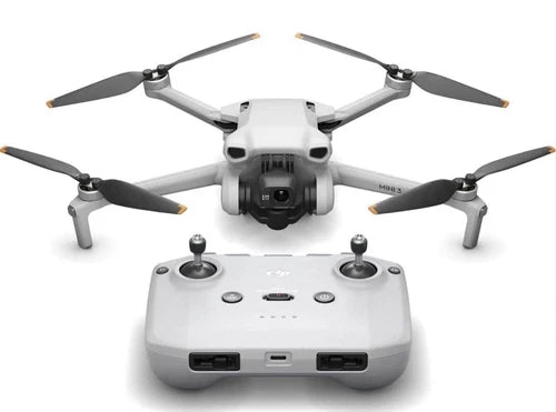 White quadcopter drone with front camera and four folding propellers