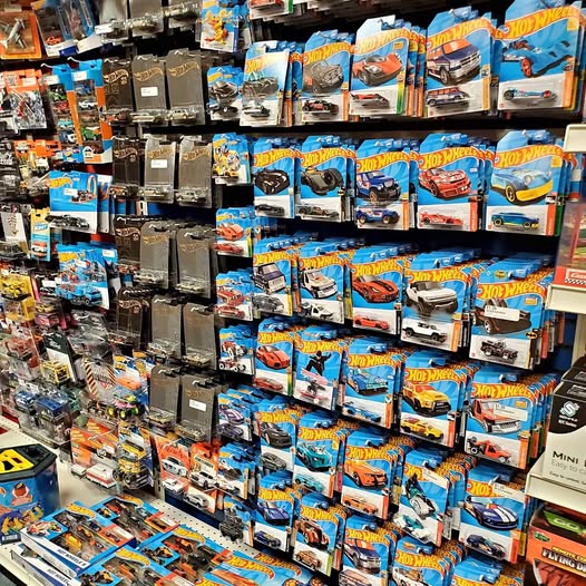 DiecastDover DE diecast car model set on retail shelf, boxed vehicles in rows