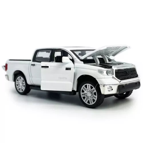 White diecast pickup truck toy with driver door open and detailed grille