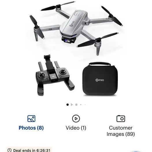 Folding drone with four propellers, controller, and black carry case