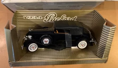 1934 Packard 1:32 diecast car in open striped box, black with chrome wheels