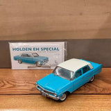 Turquoise classic diecast car model with white roof, front 3/4 view