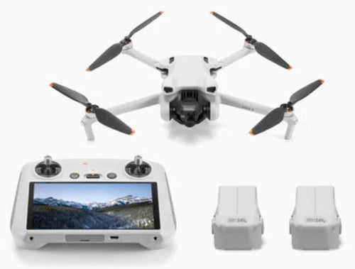 DJI Mini 3 drone with white controller and two battery charging docks