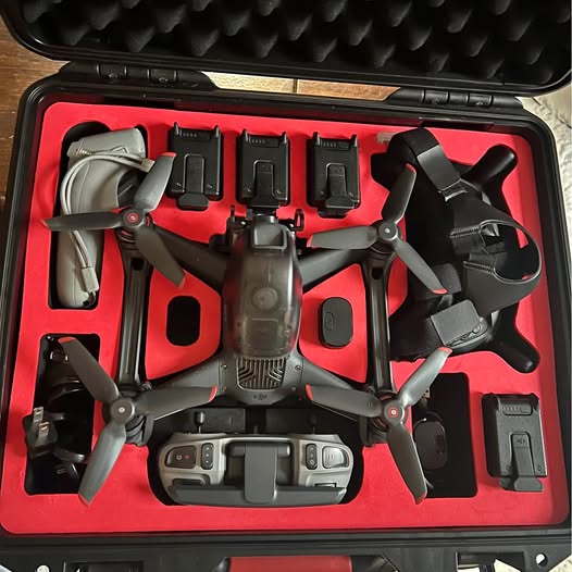 FPV drone with propellers and controller accessories in a hard case