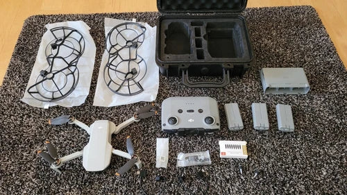 Drone bundle hardcase with propellers, prop guards, batteries, controller, and charger