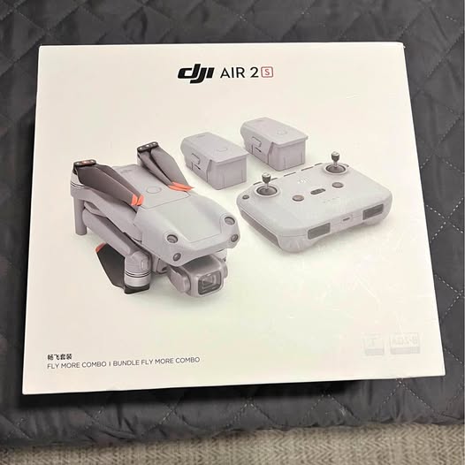 Drone kit with DJI Air 2S quadcopter and gray remote controller on package