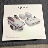 Drone kit with DJI Air 2S quadcopter and gray remote controller on package