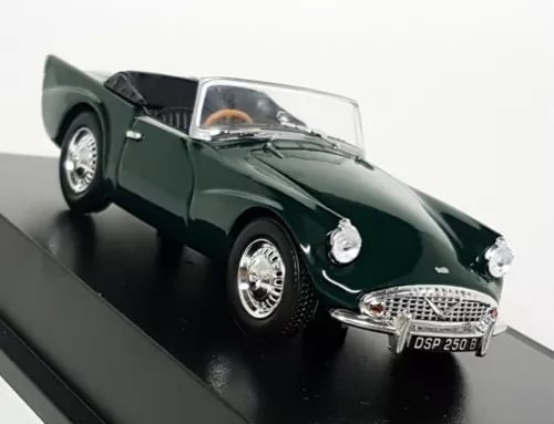 Dark green diecast model sports car with chrome front grille and bumper, 1/43 scale