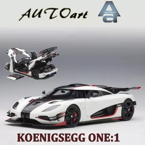 Diecast sports car model in pebble white with black aero and red trim
